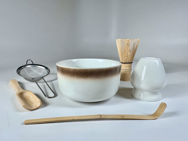 Deluxe matcha set with bowl, whisk, sifter, scoop, whisk holder, and spoon.