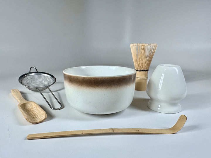 Deluxe matcha set with bowl, whisk, sifter, scoop, whisk holder, and spoon.