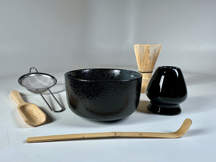 Deluxe matcha set with bowl, whisk, sifter, scoop, whisk holder, and spoon.
