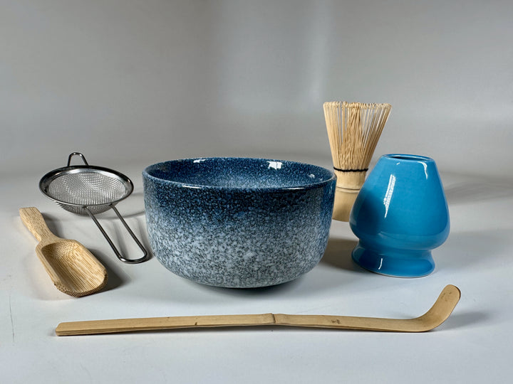 Deluxe matcha set with bowl, whisk, sifter, scoop, whisk holder, and spoon.