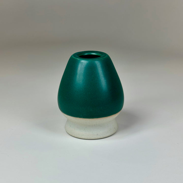 Pine green ceramic matcha whisk holder for traditional matcha preparation.