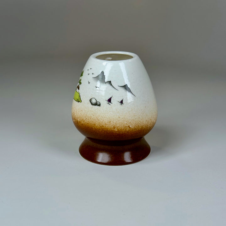 Neutral white mountain matcha whisk holder on clean background.