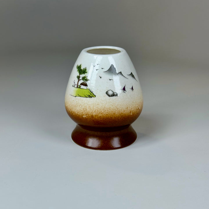 Neutral white mountain matcha whisk holder on clean background.